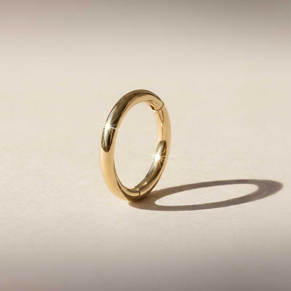 Aunyra- 14K Yellow Gold Seamless Hoop · Clicker Design