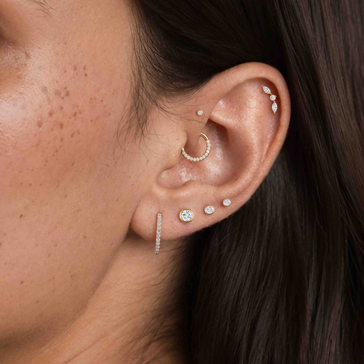 14K Yellow Gold Bezel Studs worn in a lobe piercing stack