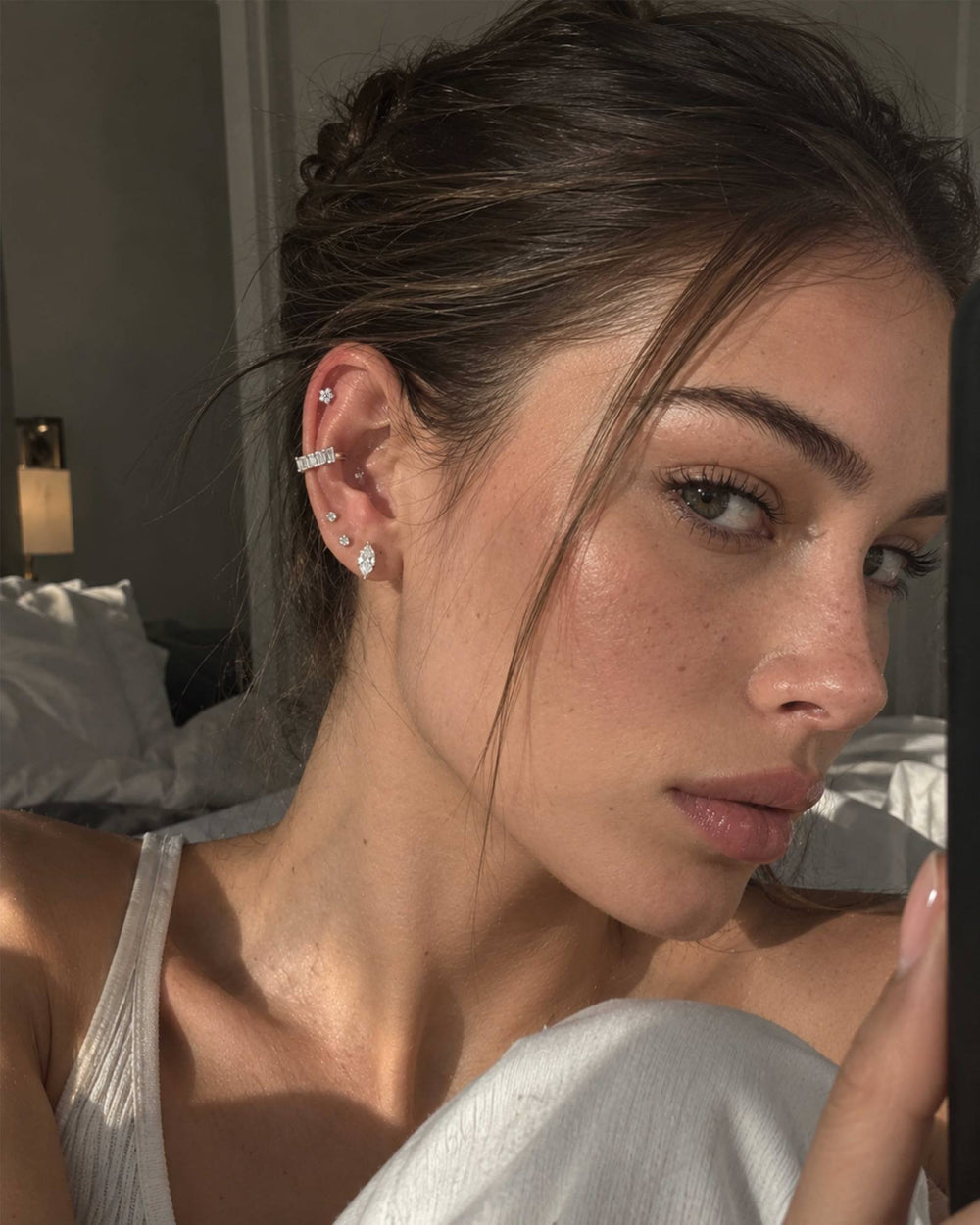 Close-up of a layered ear stack with a lobe flat back stud and helix pieces
